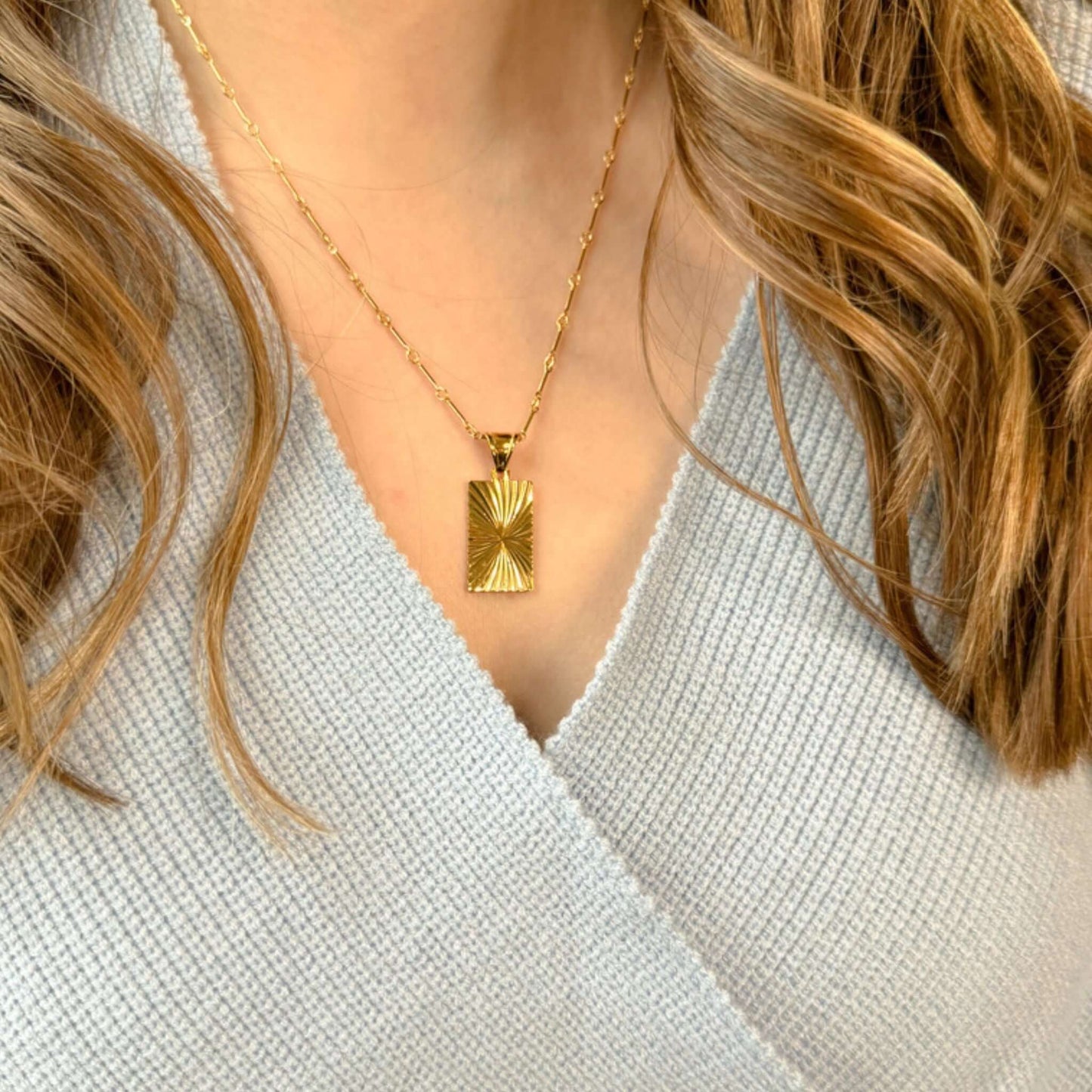 Bristol 14K Gold-Filled Geometric Pendant Necklace worn on a woman with wavy hair, sitting below the collarbone.