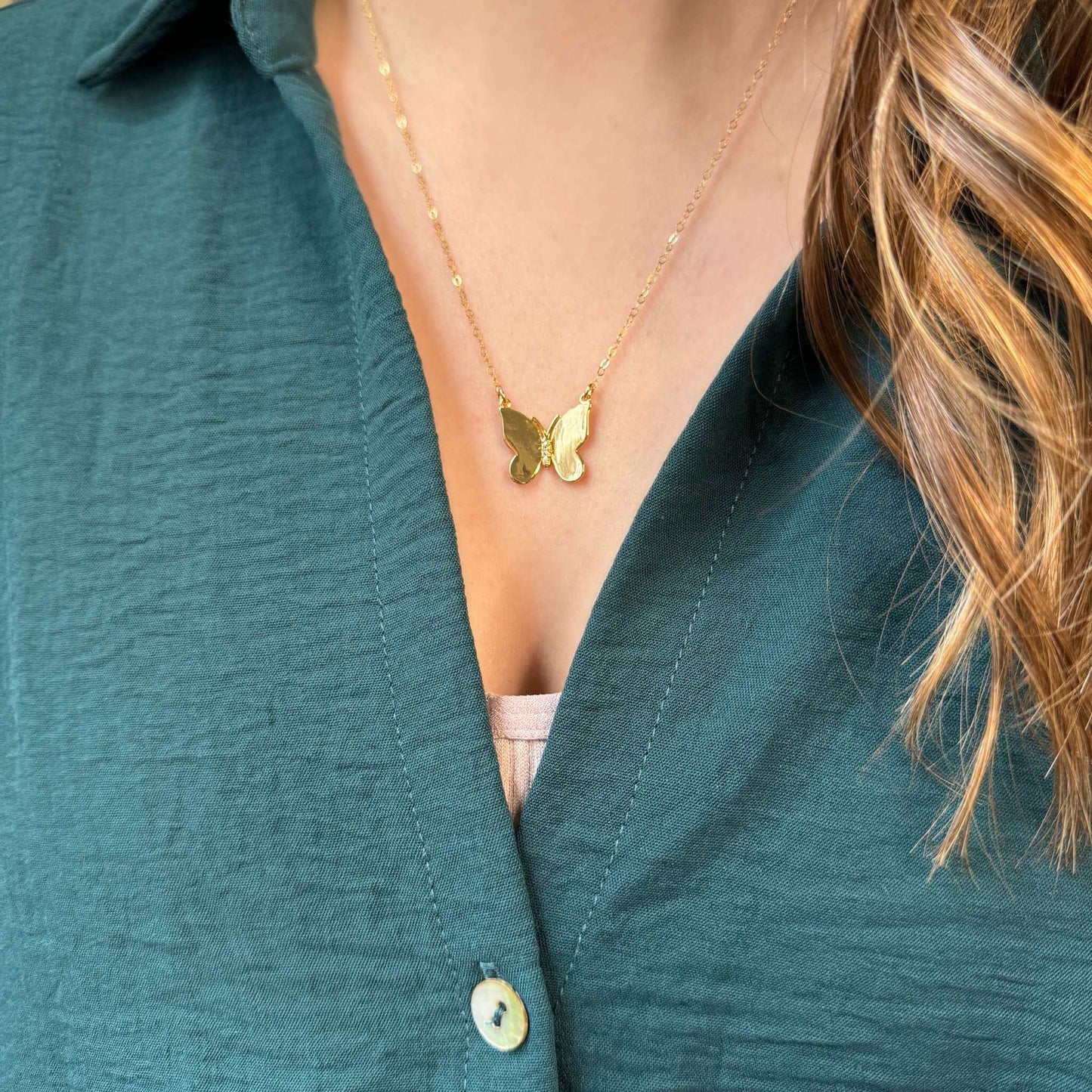 Camilla 14K Gold-Filled Butterfly Pendant Necklace worn on a person with a green shirt.