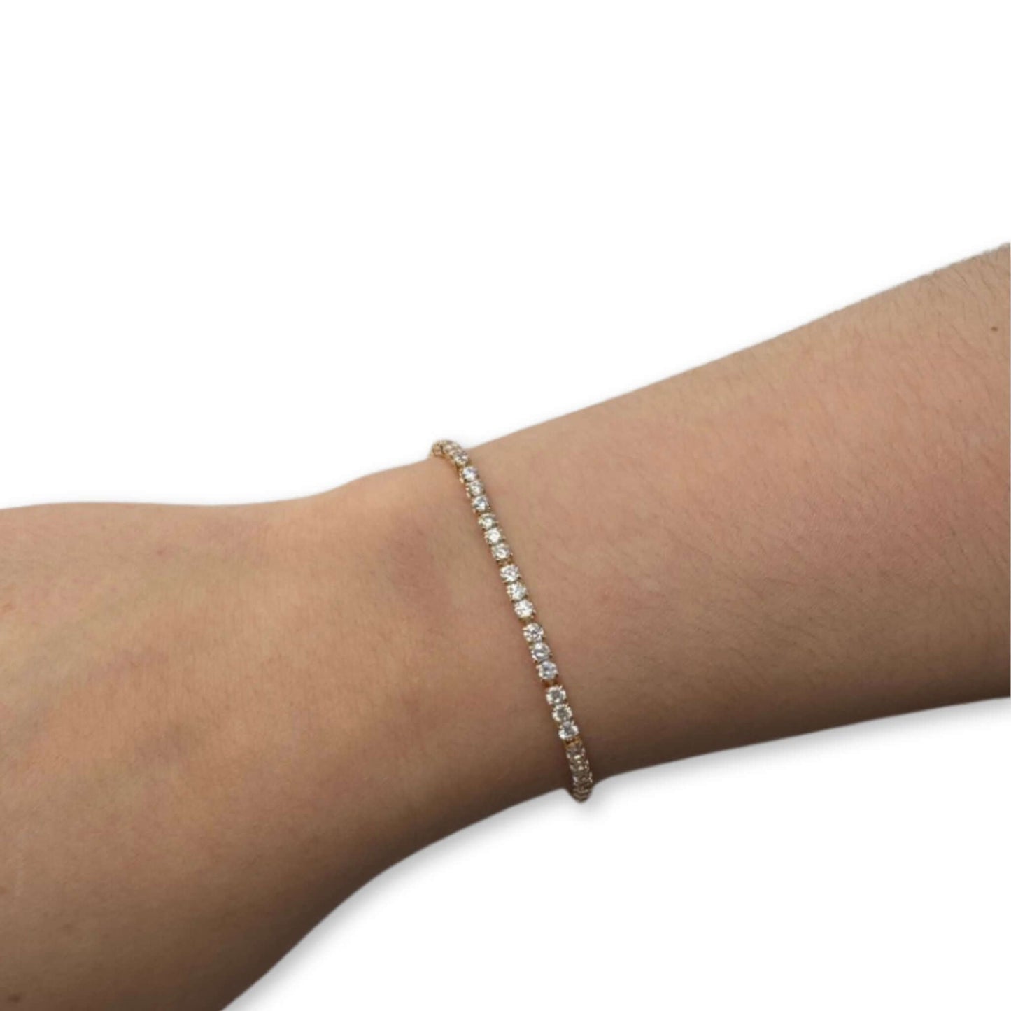 Everly 18K Gold-Filled CZ Dainty Tennis Bracelet worn on a wrist, featuring small cubic zirconia stones.
