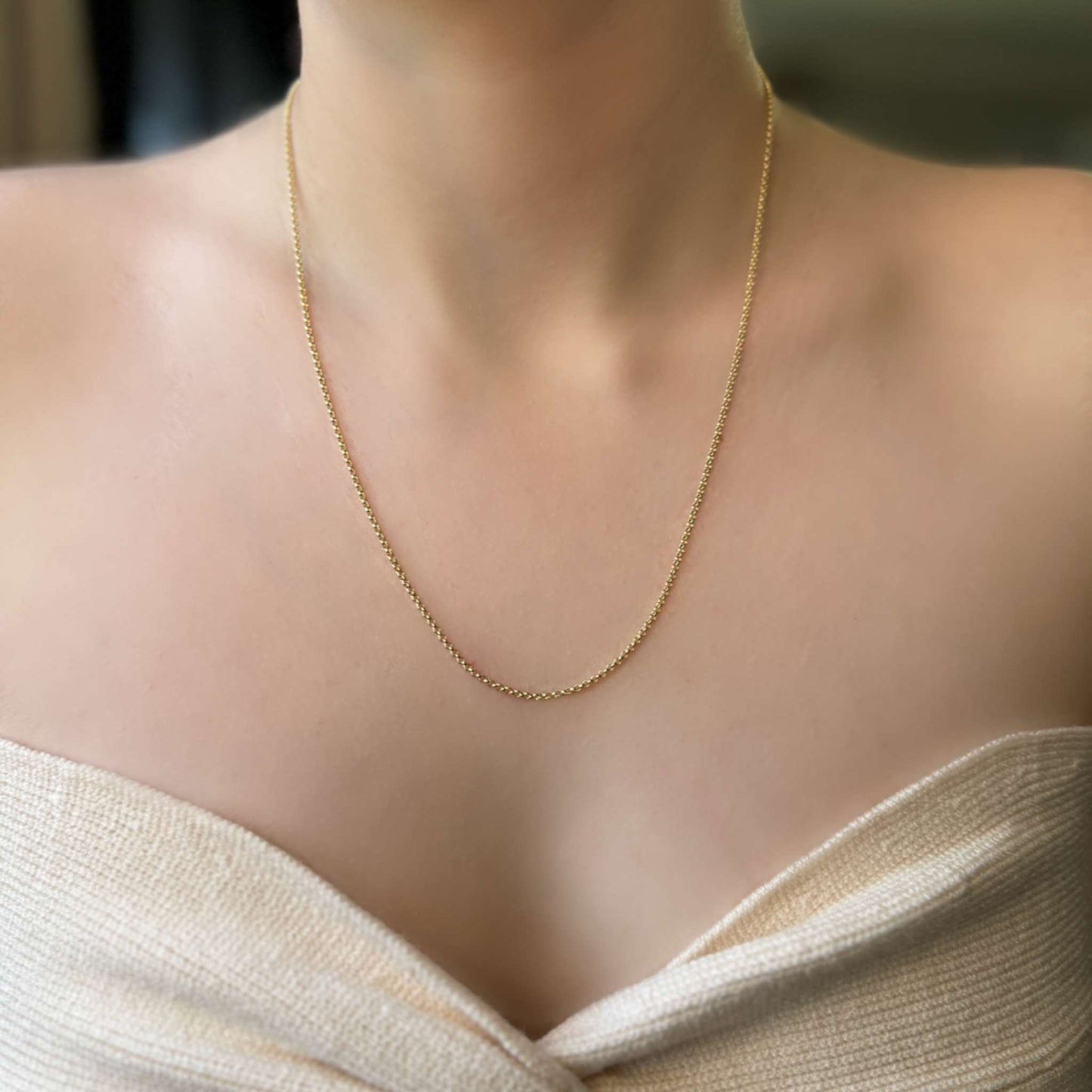 Harper 18K Gold Filled Chain Necklace worn on skin, showcasing its delicate and lightweight design.