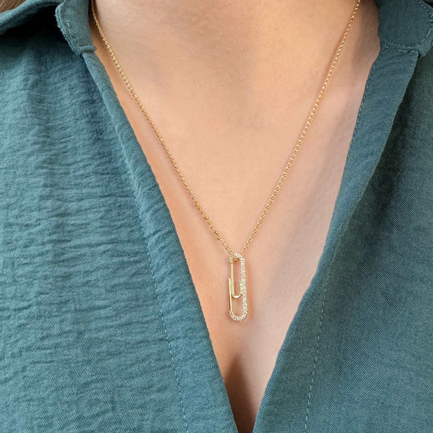 Murphy Paperclip CZ Pendant Necklace showcased on a model, featuring 18K gold-filled chain and paperclip pendant.