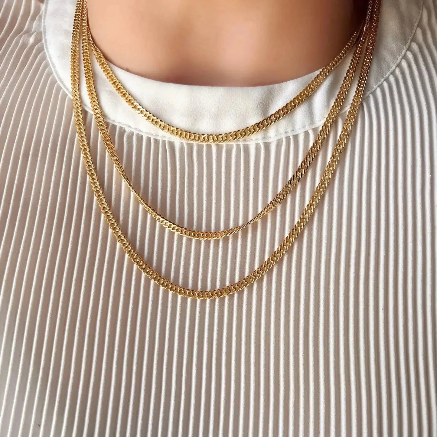 Penny 18K Gold-Filled Double Curb Chain displayed in multiple lengths on a model's neck.