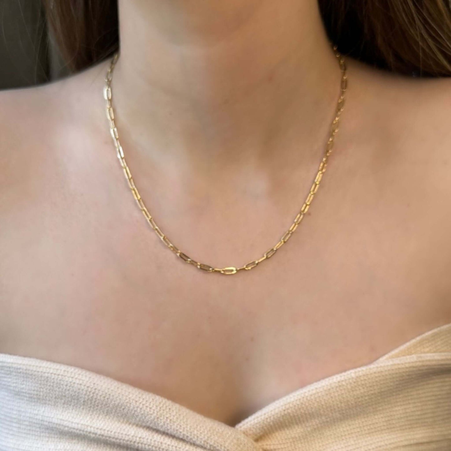 Sawyer 18K Gold-Filled Paperclip Necklace worn by a model, showcasing its elegant design on a bare neck.