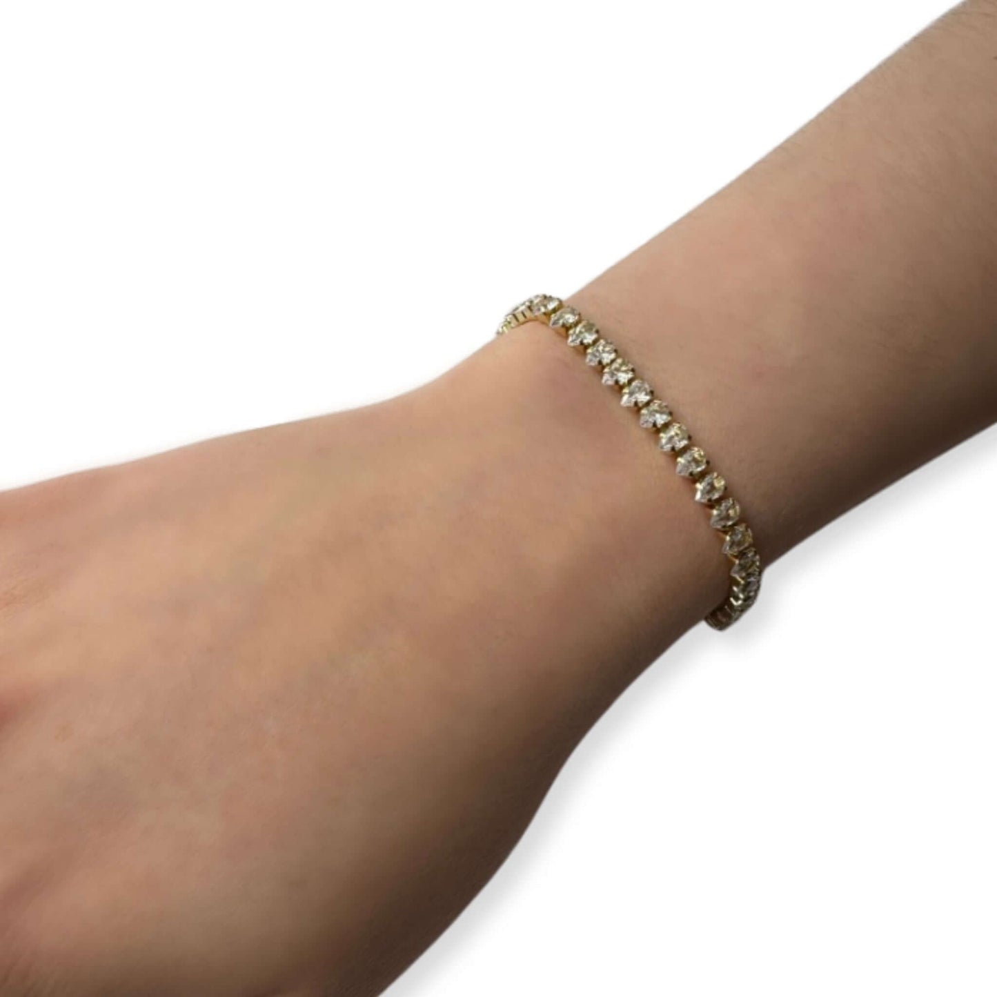 Zuri Pear-Shaped Cubic Zirconia Bracelet worn on a wrist, featuring pear-shaped stones and a gold-filled design.