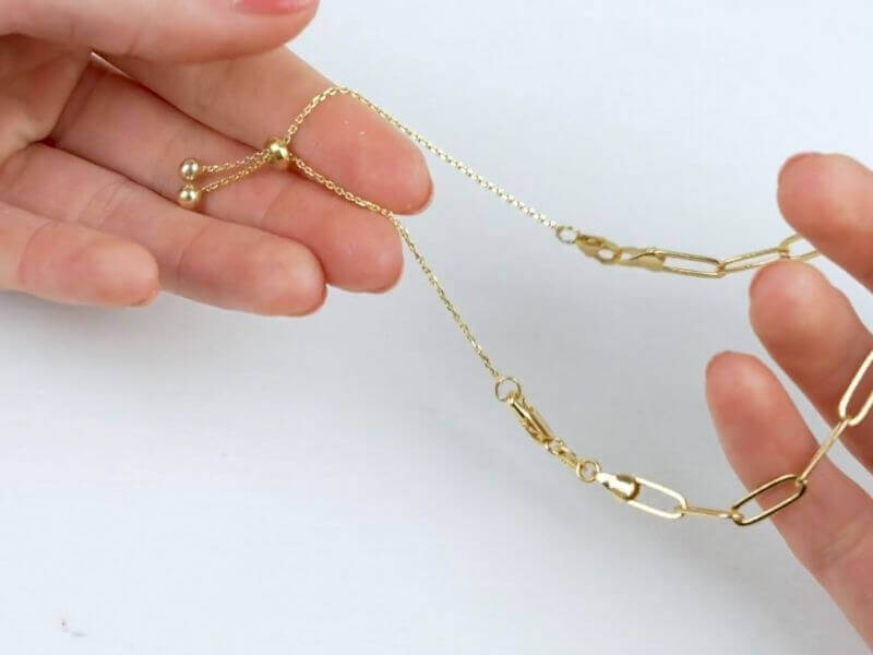3" Claspable™ Adjustable Jewelry Clasp Converter Available in Gold and Silver in use, demonstrating easy clasping.
